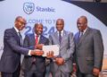 From far right: Stanbic Holdings PLC Chairman Joseph Muganda, Regional Chief Executive Patrick Mweheire, Chief Financial and Value Officer Dennis Musau, and Chief Executive Dr. Joshua Oigara during the announcement of the 2024 financial results.